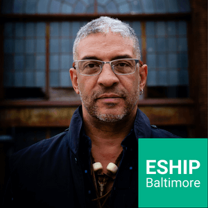 Paulo Gregory with ESHIP Baltimore logo