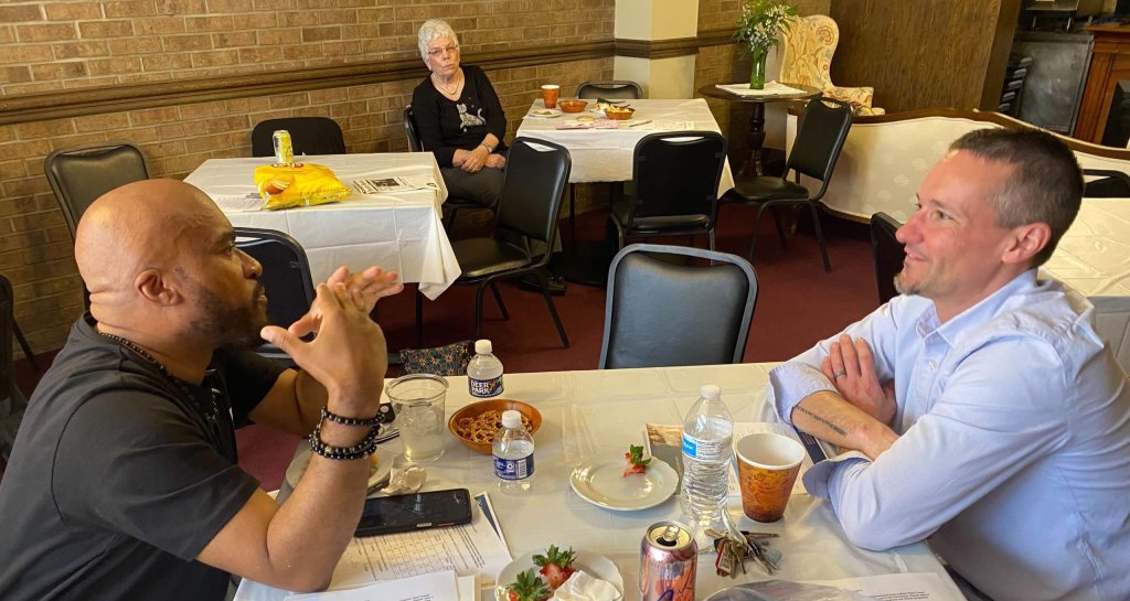 Two men sitting at a table