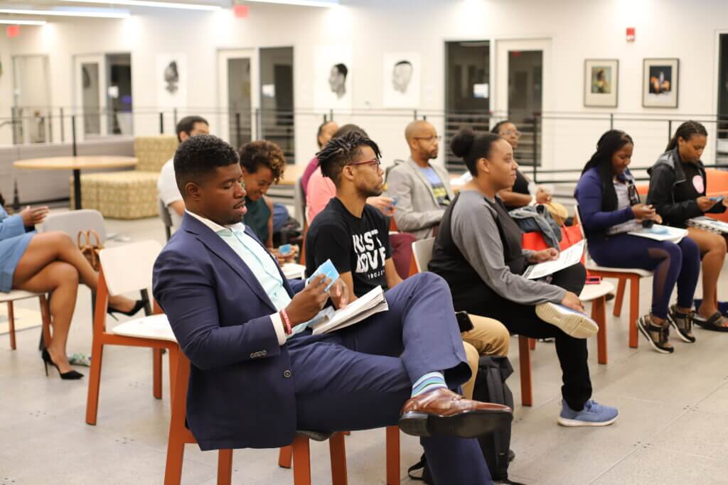 An event crowd sitting in chairs