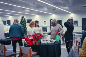people standing around a vendor table