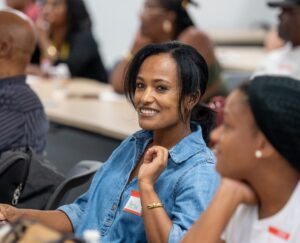 Woman smiling in a classroom setting